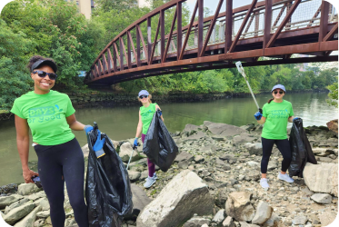 Gogo Squeez volunteering cleaning up in the community
