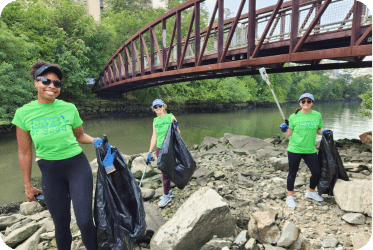 Gogo Squeez volunteering cleaning up in the community